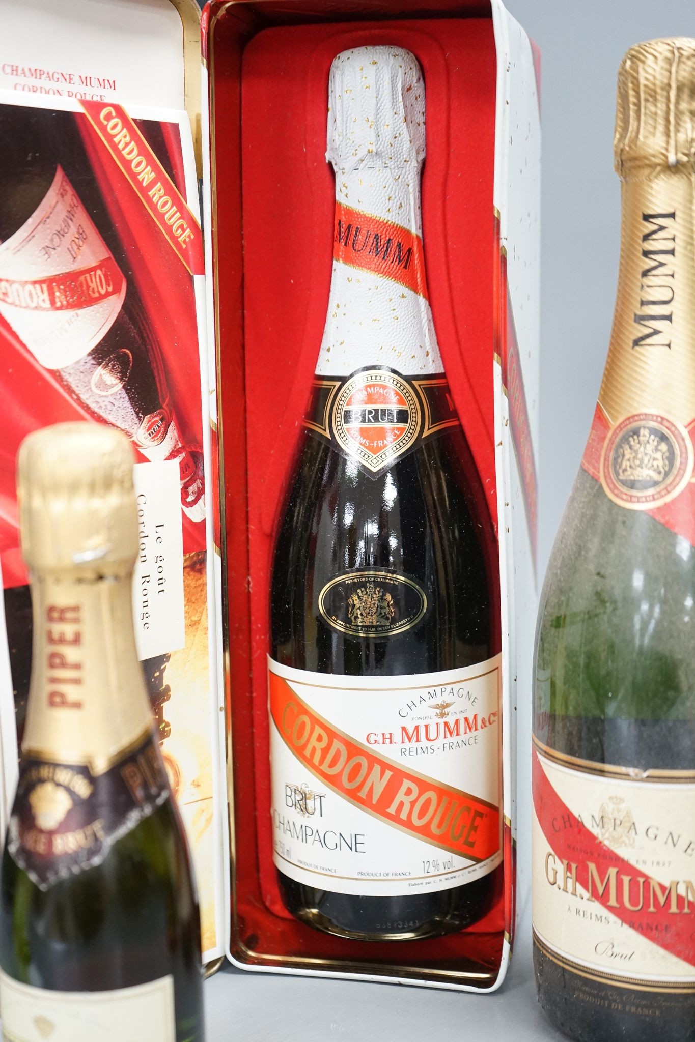 Two bottles of Mumm champagne and two small bottles of champagne